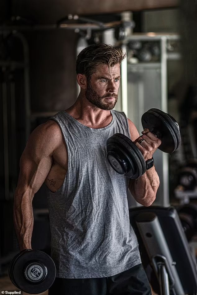 Revolve Fitness Gym athlete training with dumbbells